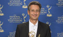 Nicholas Pike holding his Emmy Award from the National Academy of Television Arts and Sciences